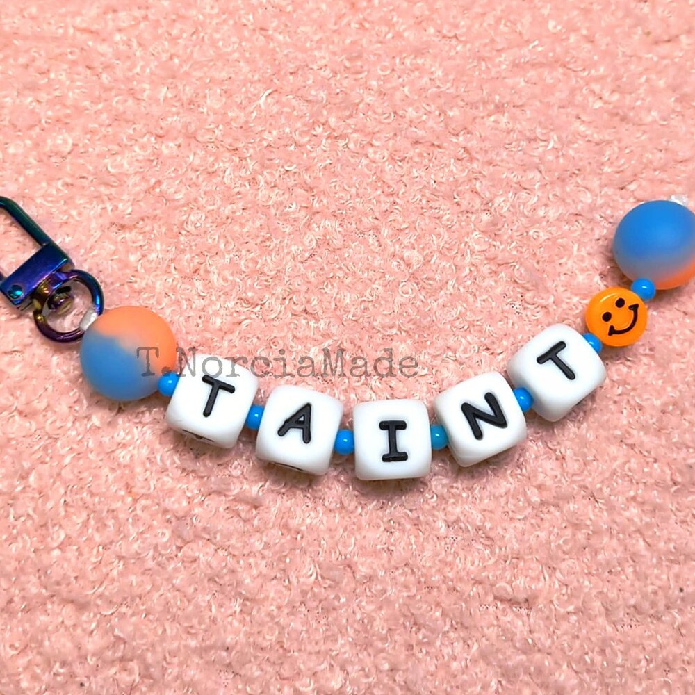 T@INT: Silicone Offensive Keychain: Glow Orange & Light Blue Split